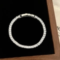 Detail shot of silver tennis bracelet with square-cut zircons in a black jewelry box - D-277 Silver Large Square Zircon Bracelet