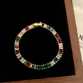 Detailed macro view of rainbow baguette-cut gemstone tennis bracelet on black velvet - D-281 Gold Baguette Cut Rainbow Zircon Bracelet