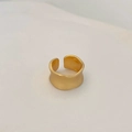 Macro shot of gold wide wavy open ring with elegant matte finish and irregular design - Gold Matte Wide Band Ring
