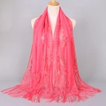 Coral pink lace scarf with floral embroidery and long tassels on mannequin display - Watermelon red