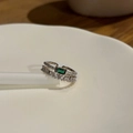 Detailed macro view of a double-layered emerald green ring with step-cut zirconia accents - Silver Peacock Green Zircon Double Layer Ring