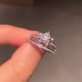 Star-shaped zircon ring with double layered sparkling bands shown in hand - Star Double Layer Hollow Zircon Ring / Silver