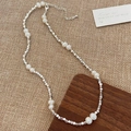 Detail of beaded necklace featuring white pearls and silver square beads on fabric background - B-318 Crushed Silver Freshwater Pearl Simple Necklace