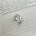 Macro shot of silver link chain open ring placed on a book page with industrial style - Chain Watch Band Style Ring (C-261)