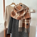 Orange and beige plaid faux cashmere scarf with tassels styled on a neutral coat - 54*205cm / Brown