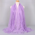 Light purple long shawl featuring hollow floral lace and delicate tassels on a mannequin - Light Purple (VS069)