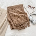 Classic brown plaid knit scarf with fringes on white bedding with accessories - Tan