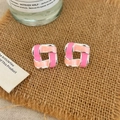 Macro detail of geometric square stud earrings with pink enamel inlay on silver metal base - Pink Drip Oil Stud Earrings