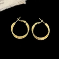 Macro detail of gold-plated hoop earrings with intricate square grid engraved texture - Diameter 2.5cm / Gold 2.5cm