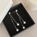 Close-up of long silver fringe earrings with lustrous pearls in a luxury gift box - Silver Pearl Tassel Stud Earrings