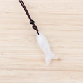 Fish shaped white semi-precious stone pendant with a brown braided cord and black bead - White Crystal