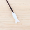 White carved semi-precious stone fish pendant with dark brown braided necklace cord - Opal (Synthetic)