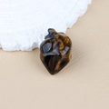 Polished natural tiger eye stone carved into a heart shape ornament for Halloween - Tiger's Eye