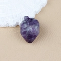 Polished natural amethyst crystal carved in a realistic anatomical heart shape model - Amethyst