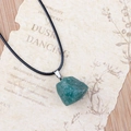 Irregular green natural stone pendant necklace with black cord on vintage paper - Green Aventurine
