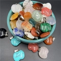 Detailed view of assorted apple-shaped natural stone pendants with silver metal clasps - Mixed Colors