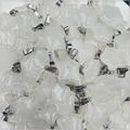 Macro shot of bulk translucent white natural stone star pendants with silver bails - Clear Quartz 1PC