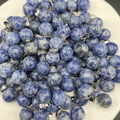 Polished blue sodalite natural stone sphere pendants with silver metal loops - Blue Spot Jasper
