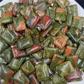 Rectangular unakite natural stone pendants with silver metal clasps on white background - Unakite