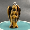 Macro shot of tiger eye stone angel pendant with polished yellow and black stripes - Tiger's Eye