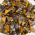 Bulk display of triangular tiger eye stone pendants with silver metal clasps - Tiger's Eye