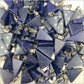 Close-up of blue goldstone triangle pendants with glittering finish and silver bails - Blue Sandstone (Synthetic)