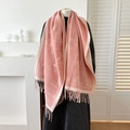 Pink pashmina scarf with white cat pattern and tassel fringe on a mannequin - Pink