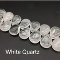 Macro detail of transparent teardrop clear quartz beads showing natural icy textures - 13x18mm Clear Quartz