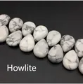 Macro shot of teardrop-shaped white howlite stone beads with grey marble veins for jewelry diy - 13x18mm Howlite