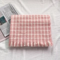 Pink and white checkered cashmere scarf with decorative tassels on white background - Pink