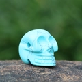 Blue turquoise skull pendant with black spiderweb veins for Halloween jewelry making - Blue Turquoise (Synthetic)