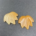 Macro shot of maple leaf stone pendants showing detailed carved veins and textures - Yellow Topaz/Jade 1PC