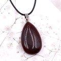 Deep red teardrop natural carnelian agate pendant on a black woven cord necklace - Red Jasper