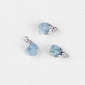 Three irregular light blue raw aquamarine pendants with textured silver plated edges - Aquamarine