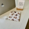 Cute cream quilted makeup bag featuring brown bear prints with a silver zipper - Short Polka Dot Bear