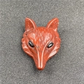 Detailed view of hand-carved red jasper fox head pendant with inlaid black bead eyes - Rainbow Stone (1 Piece)