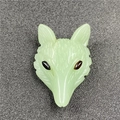 Macro detail of hand-carved light green fox head pendant with fine engraved textures - Green Aventurine (1 Piece)