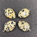 Detail of four teardrop Dalmatian Jasper pendants with polished silver metal bails - Dalmatian Jasper