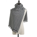 Classic black and white houndstooth scarf with soft fringe trim on a display mannequin - Houndstooth Black
