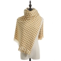 Yellow and white houndstooth scarf with soft fringe trim on a mannequin display - Houndstooth Yellow
