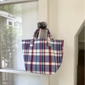 Colorful striped canvas tote bag with red, white, and blue patterns and sturdy handles - Blue