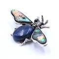 Vintage silver bee brooch featuring a large oval blue lapis and iridescent abalone shell wings - Lapis Lazuli