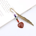 Bronze feather bookmark with colorful beads and heart-shaped sandstone pendant - Gold Sandstone