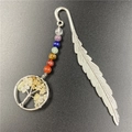 Detail of silver feather bookmark with seven chakra stones and tree of life pendant - Citrine