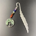 Detail of silver feather bookmark with colorful chakra beads and tree of life pendant - Green Aventurine