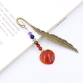 Vintage bronze feather bookmark featuring colorful round beads and red heart stone pendant - Red Agate