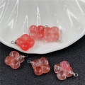 Macro detail of translucent pink quartz clover pendants with silver metal bails - Watermelon Red (Synthetic)