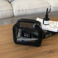 Portable black mesh storage bag with sturdy top handle and cute cartoon patch detail - Rectangular Toiletry Bag
