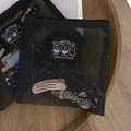 Portable black mesh storage bag with cartoon patch and zipper for travel accessories - Square Storage Pouch