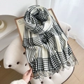 Cozy black and white plaid knit scarf with fringe trim on a beige vintage armchair - 180cmx66cm / White
